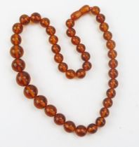 A Graduated Amber Bead Necklace, 15.2x14.7mm, 18.5" (47cm), 31.6g