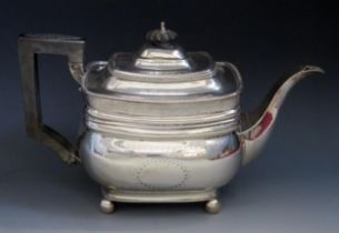 A George III silver teapot, maker's mark worn, London, 1813, of barge-shaped outline, with domed