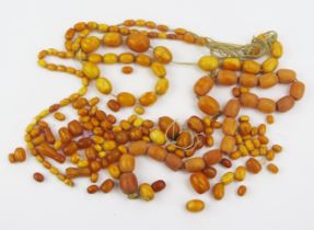 A Quantity of Amber and Faux Amber Beads, largest 21.4x16.1mm, 112.88g