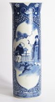 A Chinese blue and white sleeve vase, decorated with figures in a garden landscape, bears four