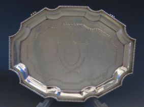 A George V silver teapot stand, maker Mappin & Webb, Sheffield, 1912, of cartouche-shaped outline,