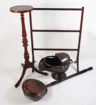 A copper coal scuttle of helmet outline, together with a copper warming pan with ring turned handle.