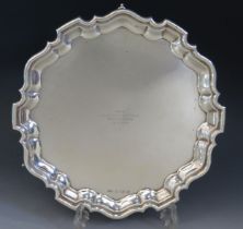A George VI silver salver, maker Viners Ltd, Sheffield, 1951, inscribed, of circular outline with