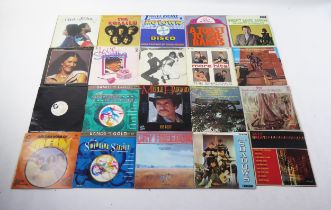 A collection of 33rpm records, various artists including the Shadows, The Hollies, Moody Blues, Joan