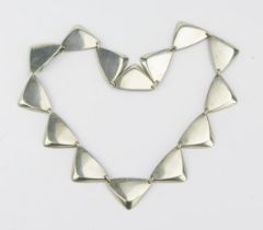 A Hans Hansen Danish Silver Peak Necklace, composed of fourteen bevelled triangular links, completed