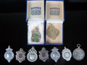A collection of silver and plated fobs and medallions, various makers and dates. (a lot).