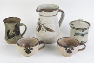 A Robert Tinntyunt jug, a David Winkley preserve pot and cover, an A J Stuart pottery mug, two J