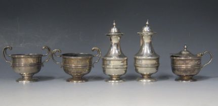 An Edward VII silver five-piece condiment set, maker The Uricara Co, Birmingham, 1907, total