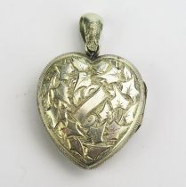 A Victorian Precious White Metal Heart Shaped Locket Pendant with chased foliate decoration, 41.