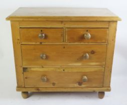 A stripped pine rectangular chest, the top with a moulded edge, containing two short and two long
