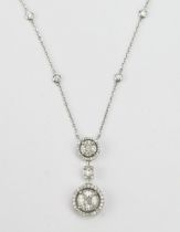 A Middle Eastern 18ct White Gold and Diamond Pendant on integral chain set with brilliant round,