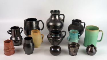 A collection of Dicker pottery wares, including tumbler, vases, jugs and mugs,