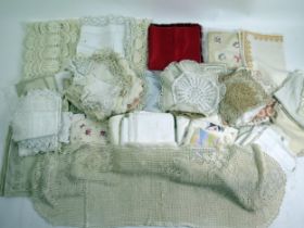 A collection of linen table cloths, napkins, some with cutwork decoration or crochet borders, (a