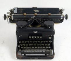 A Royal manual office typewriter, with black casing and 36cm roller.