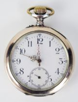 A Silver and Gilt Open Dial Keyless Pocket Watch with engraved crest to the back, the dust plate