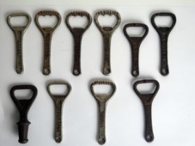 A collection of novelty bottle stoppers, bottle openers etc.