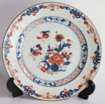 A late 19th century Chinese Imari porcelain plate, with central floral spray and stylised scroll