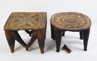 A Nupe tribe carved wood stool, with geometric pattern decoration to the seat, 29cm high, 36cm wide,