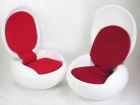 After a design by Peter Ghczy, a pair of fibreglass garden egg chairs, of squat ovoid form with