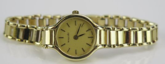 A MALLORY Ladies 14K Gold Wristwatch on a 14K gold bracelet, quartz movement, 18.77g gross with