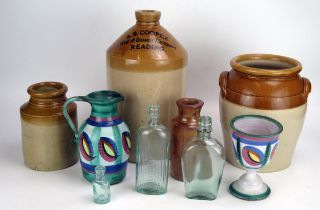 Four assorted stoneware storage jars, glass bottles etc.