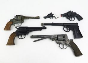 A T.J.Harrington air pistol, together with five assorted toy and replica pistols.
