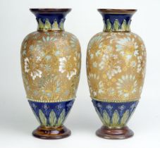 A pair of Royal Doulton vases, of ovoid form, with palmette decorated necks, and all-over floral