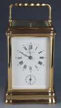 L'Epee a contemporary French Garrard retailed lacquered brass carriage clock, with 7.5cm Roman