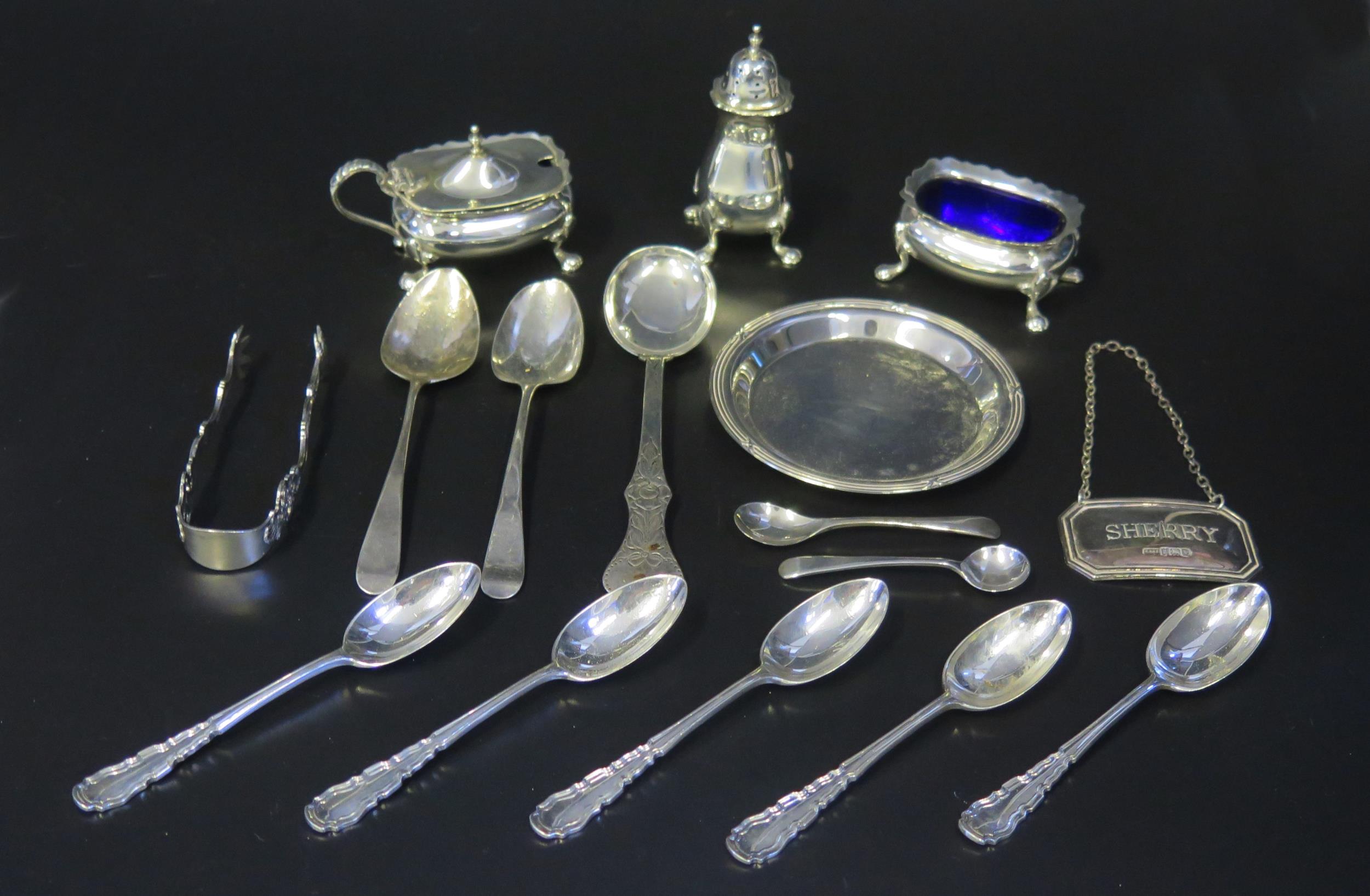 A mixed collection of silver wares, various makers and dates, includes wine label, three-piece
