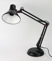 A 1970's period model 50728 angle-poise lamp in black, on a weighted circular base.