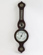 A Victorian mahogany onion topped wheel barometer, fitted with hygrometer, mercurial thermometer,