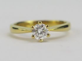 An 18ct Yellow Gold and Diamond Solitaire Ring, 5.11mm claw set brilliant round cut, size M.5,