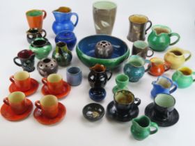 W F Holland and others a collection of assorted ceramic wares including jugs, mugs, fruit bowl,