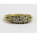 A Victorian 18ct Gold and Diamond Five Stone Ring, largest old cut c. 3.65mm claw set with chased