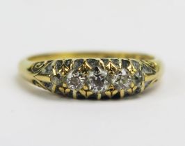 A Victorian 18ct Gold and Diamond Five Stone Ring, largest old cut c. 3.65mm claw set with chased