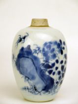 A Chinese blue and white porcelain ovoid vase with rock and fauna decoration, 11cm high.