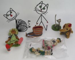 A pair of novelty wire cat desk tidy's a novelty elephant tape measure, and assorted dolls.