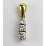 An 18ct Gold and Diamond Pendant set with three brilliant round cuts, largest c. 2.7mm, 15.2mm drop,
