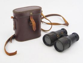 A pair of early 20th century multi-functional binoculars for theatre, field, and Marine, contained