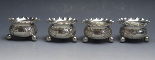 A set of four Victorian silver salts, maker J E Bushell, Birmingham, 1900, of circular form with