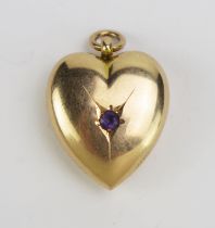 An Antique 15ct Gold and Amethyst Heart Shaped Pendant, 26.3mm drop inclusive of suspension ring,