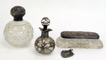 Two clear glass and silver mounted scent bottles, together with a glass and silver mounted