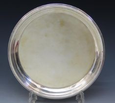 A German silver dish, stamped marks, of plain circular form, 21.5cm diameter, 192gms, 6.20ozs