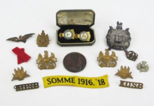 A small collection of army badges, Army rifle medallion, RAF enamel lapel badges etc.