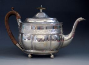 A George III silver teapot, maker Peter & William Bateman, London, crested, of oval lobed outline