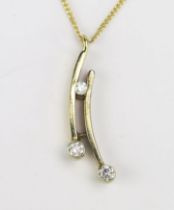 A Yellow and White Gold and Diamond Pendant on chain, c. 2.7mm principal stones, 29mm drop and on an