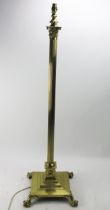 A 20th century brass Corinthian column telescopic standard lamp, with reeded column on a stepped