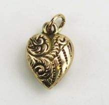An Antique Precious Yellow Metal Heart Shaped Pendant with chased foliate scroll decoration, 16mm