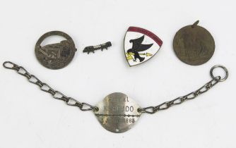 A French lapel badge commemorating the battle for Verdun, an identity tag, a peace medal and a