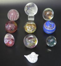 A collection of ten assorted glass paperweights, by various manufacturers, some boxed.
